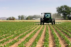 farmer on his tractor plowing the field, rural wyoming